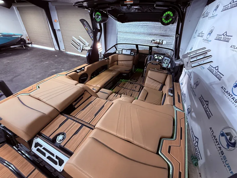 Slide: The Image of Interior of 2023 Supra SA 400 boat with luxurious leather seating. - 19