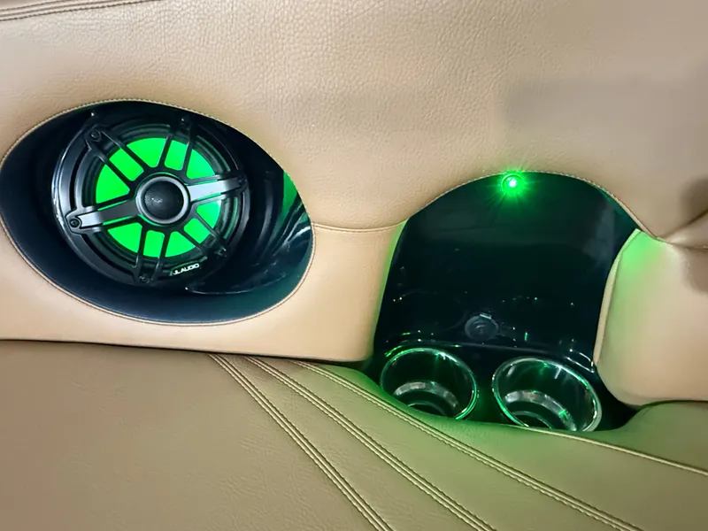Slide: The Image of Interior of Supra SA 400 featuring speaker and green lighting. - 35