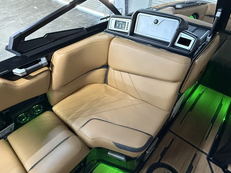 Slide: The Image of Interior of 2023 Supra SA 400 boat with beige leather seats. - 36