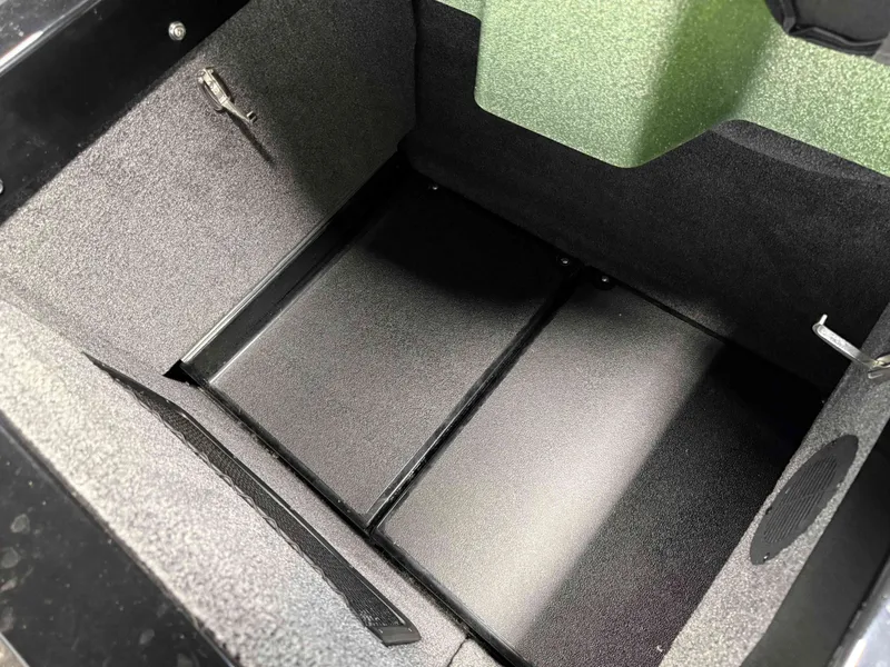 Slide: The Image of Interior of 2023 Supra SA 400, empty storage compartment. - 37