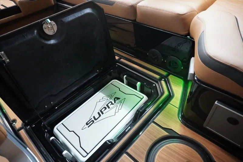 Slide: The Image of Interior of 2023 Supra SA 400 with storage compartment. - 38