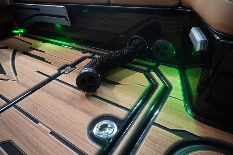 Slide: The Image of Interior of Supra SA 400 boat with wood finish and green lighting. - 39