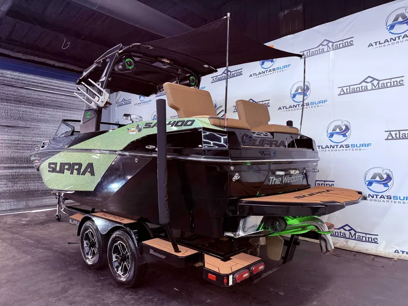 Slide: The Image of 2023 Supra SA 400 boat in a showroom. - 4