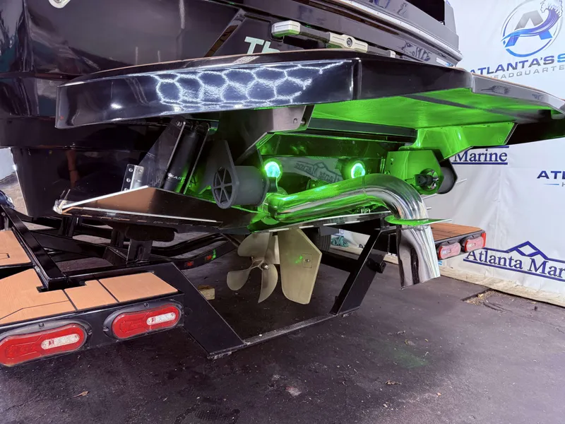 Slide: The Image of Rear view of 2023 Supra SA 400 with green underwater lighting. - 6