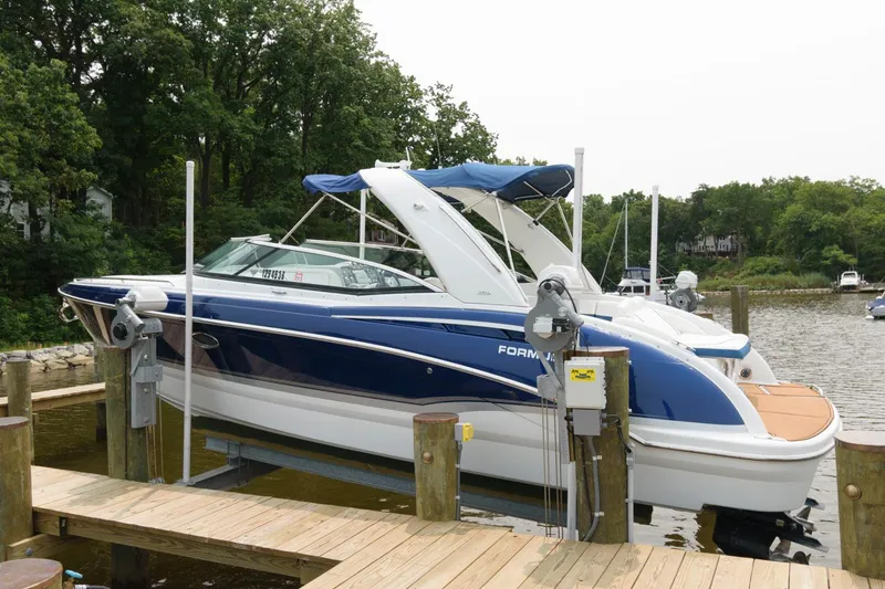 The Image of 2012 Formula 310 Bowrider boat docked at a marina. - 0