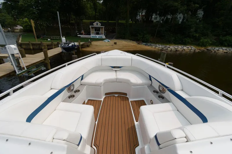 Slide: The Image of 2012 Formula 310 Bowrider boat with spacious seating and teak flooring. - 10