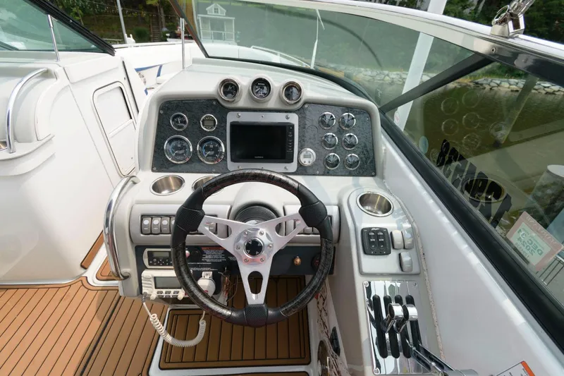 Slide: The Image of 2012 Formula 310 Bowrider dashboard with steering wheel and control panel. - 8