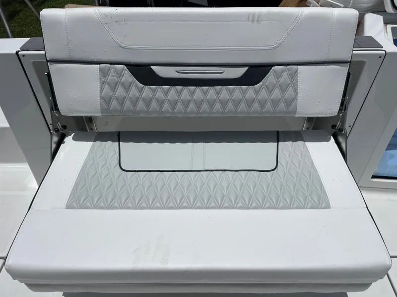 Slide: The Image of 2024 Blackfin 332cc boat with white cushioned seating. - 14