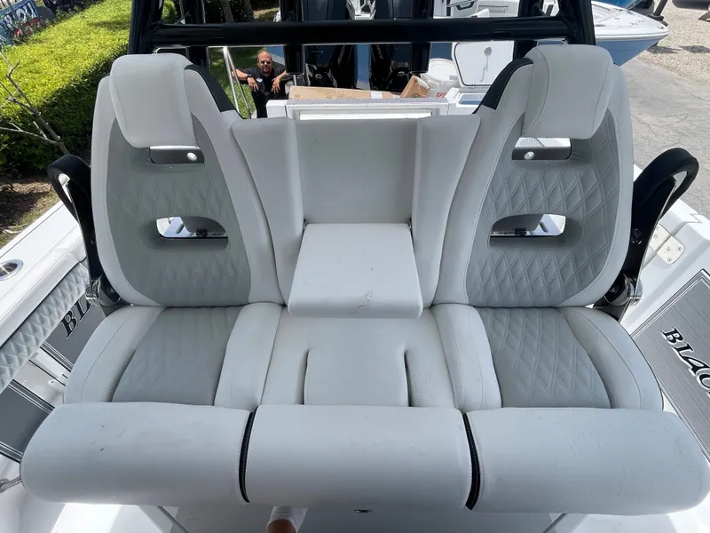 Slide: The Image of 2024 Blackfin 332cc boat with luxurious white seating. - 17