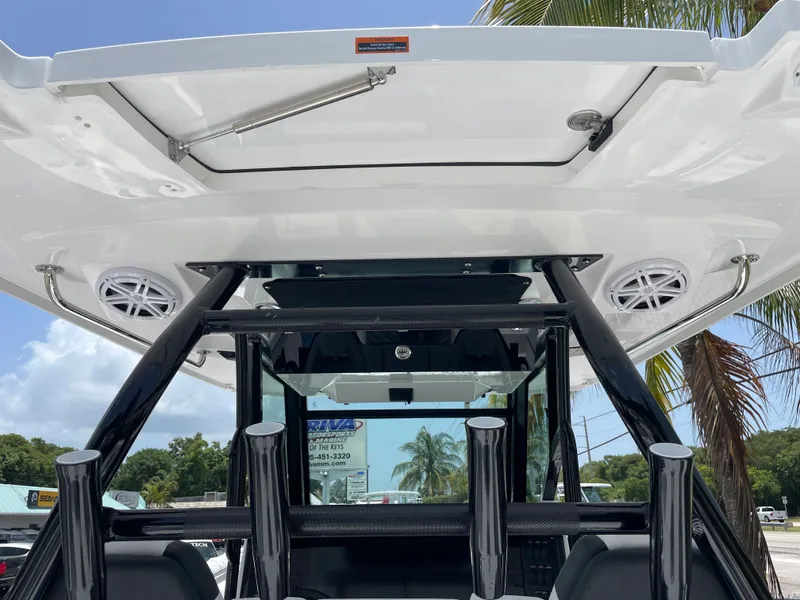 Slide: The Image of 2024 Blackfin 332cc boat with T-top and rod holders. - 26