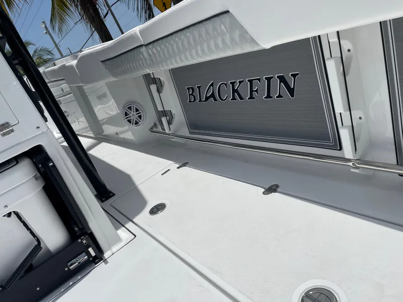 Slide: The Image of 2024 Blackfin 332cc boat deck with logo, white and gray interior. - 28