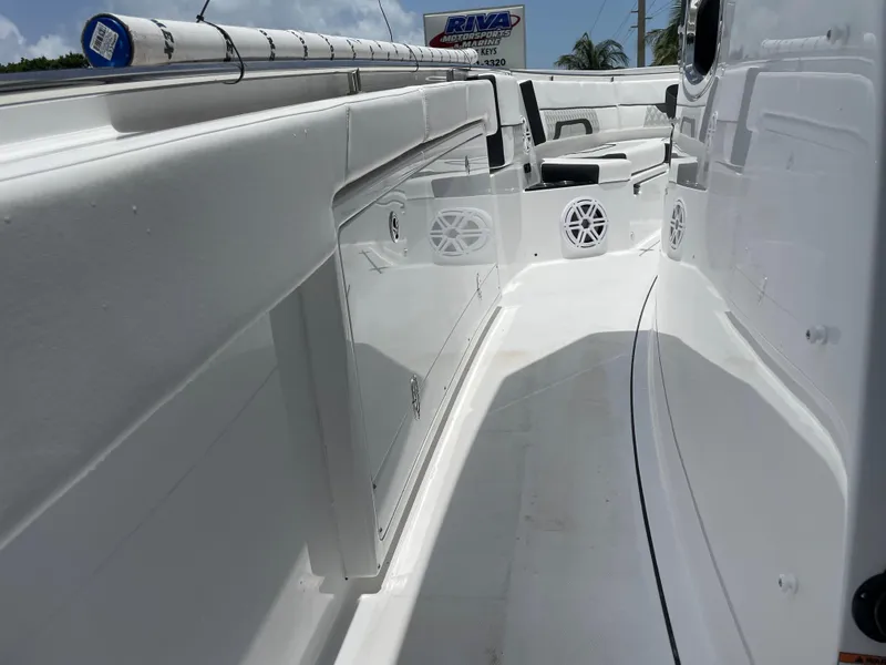 Slide: The Image of 2024 Blackfin 332cc boat interior with storage compartments and seating. - 29