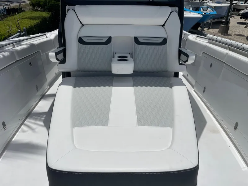 Slide: The Image of 2024 Blackfin 332cc boat with luxurious white and gray seating. - 35