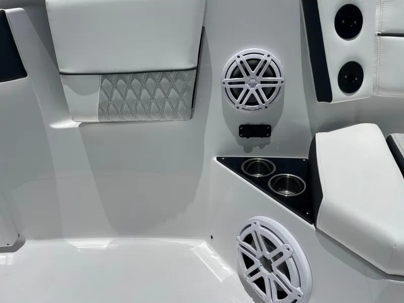 Slide: The Image of 2024 Blackfin 332cc boat interior with speakers and cup holders. - 37