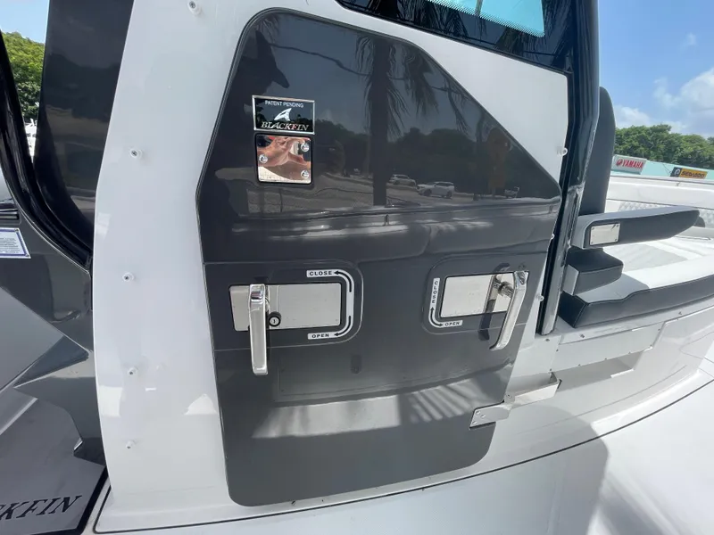 Slide: The Image of 2024 Blackfin 332cc boat door with sleek design and secure latches. - 44