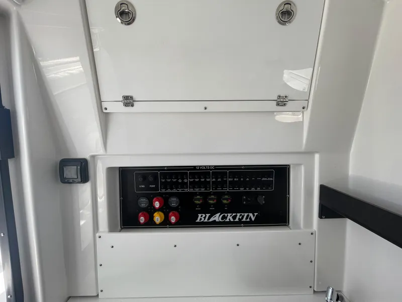 Slide: The Image of 2024 Blackfin 332cc control panel with switches and gauges. - 48