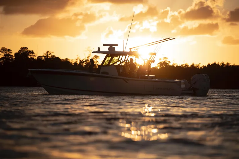 Slide: The Image of 2024 Blackfin 332cc boat at sunset on calm waters. - 49