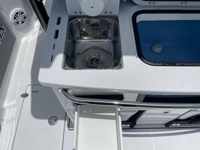 Slide: The Image of 2024 Blackfin 332cc boat sink and storage area. - 5
