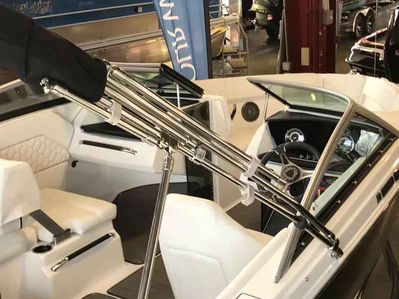 Slide: The Image of 2024 Four Winns H1 boat interior with white seating and chrome details. - 4