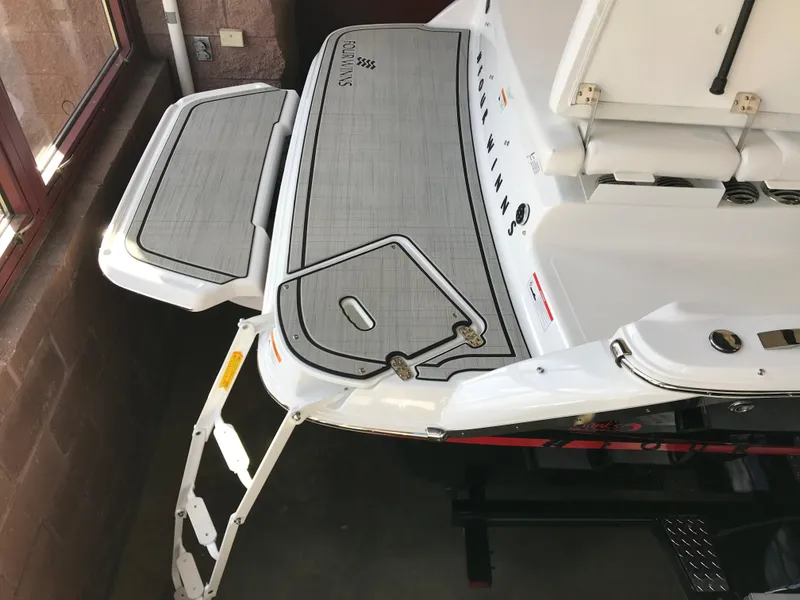 Slide: The Image of 2024 Four Winns H1 boat swim platform with ladder and seating area. - 5