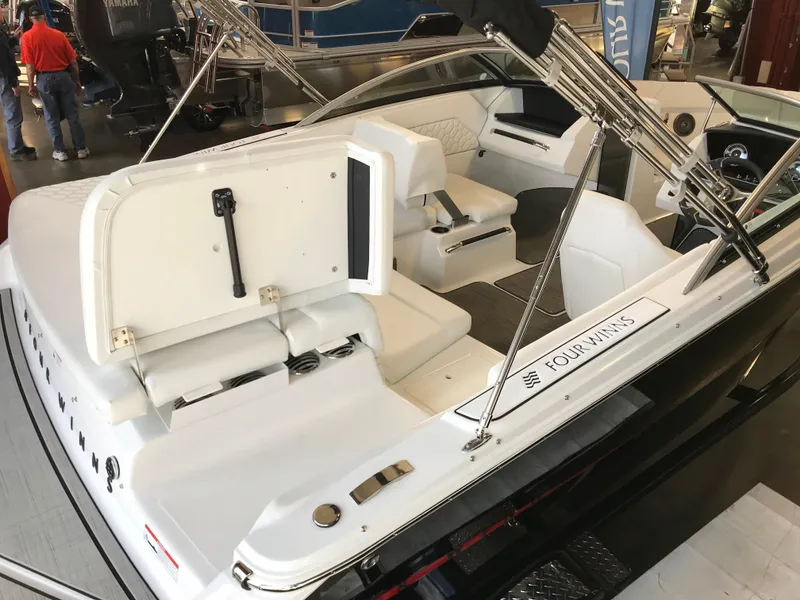 Slide: The Image of 2024 Four Winns H1 boat interior with white seating and sleek design. - 6