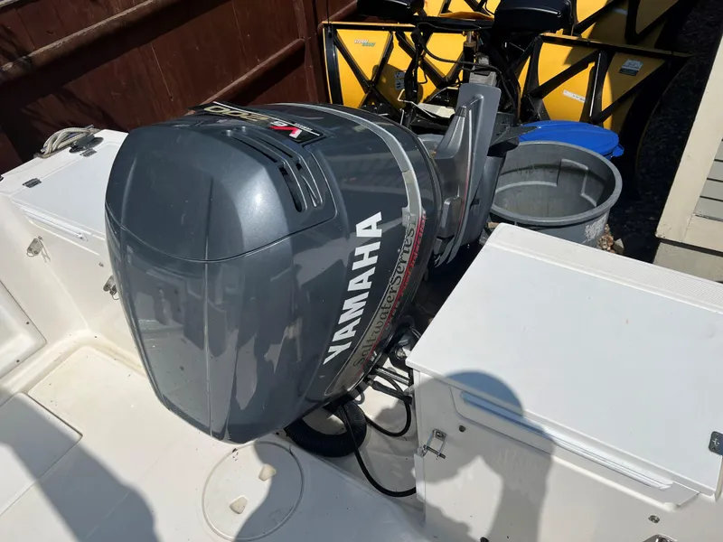 Slide: The Image of 2005 Aquasport 215 Explorer with Yamaha outboard motor. - 10