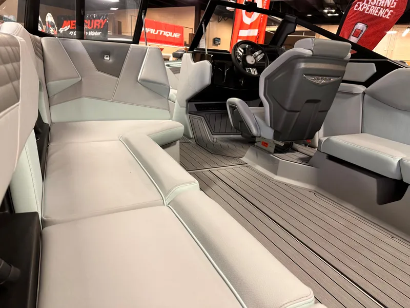 Slide: The Image of 2023 Nautique S23 boat interior with luxurious seating and modern design. - 3