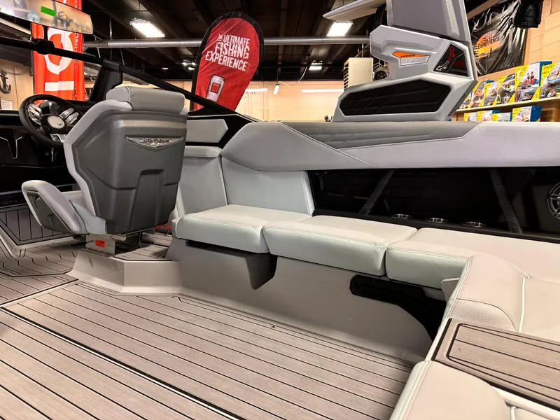 Slide: The Image of 2023 Nautique S23 boat interior with grey seating and modern design. - 4