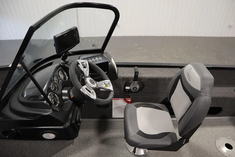 Slide: The Image of 2024 Lowe Fishing Machine 1675WT interior with steering wheel and seat. - 22