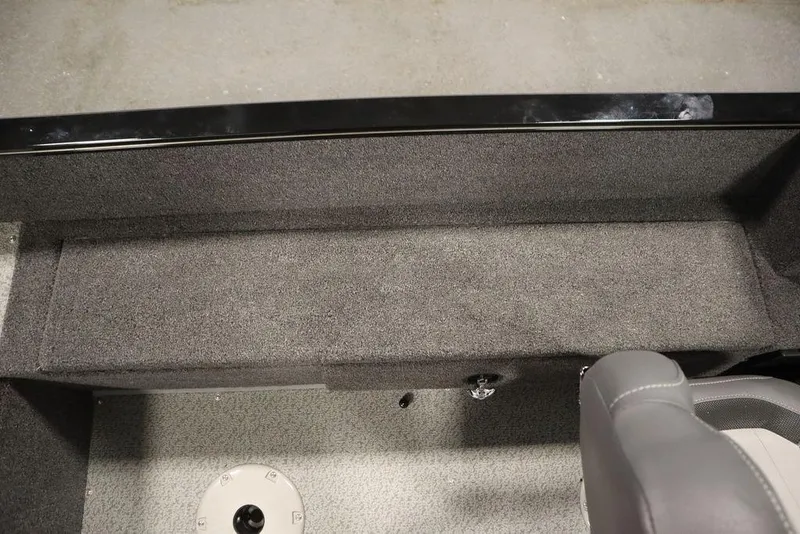 Slide: The Image of 2024 Lowe Fishing Machine 1675WT interior with gray carpet and seating. - 35