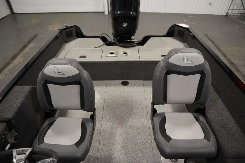 Slide: The Image of 2024 Lowe Fishing Machine 1675WT interior with two gray seats and motor. - 36
