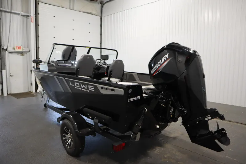 Slide: The Image of 2024 Lowe Fishing Machine 1675WT boat in a spacious indoor garage. - 4