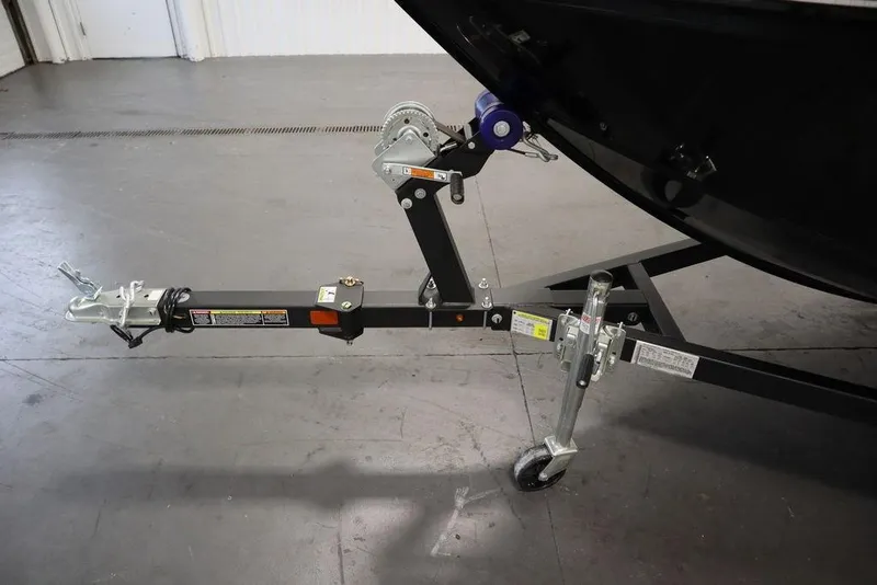 Slide: The Image of Trailer hitch of 2024 Lowe Fishing Machine 1675WT boat in a garage setting. - 43
