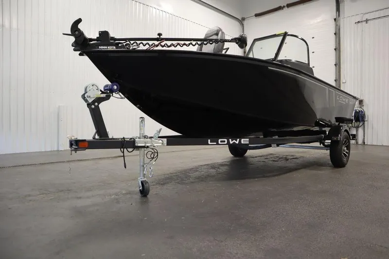 Slide: The Image of 2024 Lowe Fishing Machine 1675WT on trailer in indoor setting. - 50