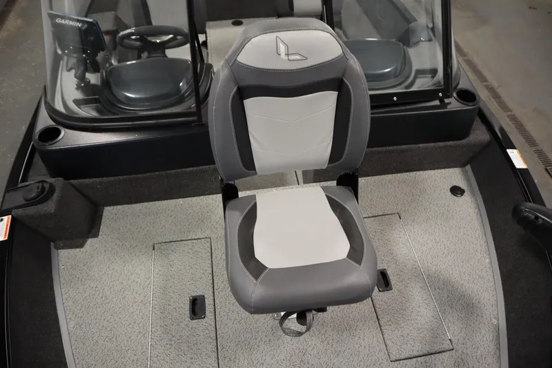 Slide: The Image of 2024 Lowe Fishing Machine 1675WT in a garage, rear view of the boat. - 8