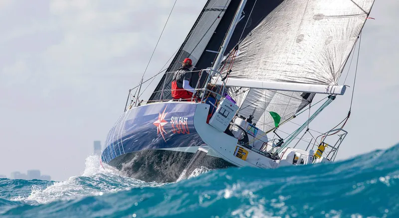 Slide: The Image of 2024 Jeanneau Sun Fast 3300 sailing on open water. - 12