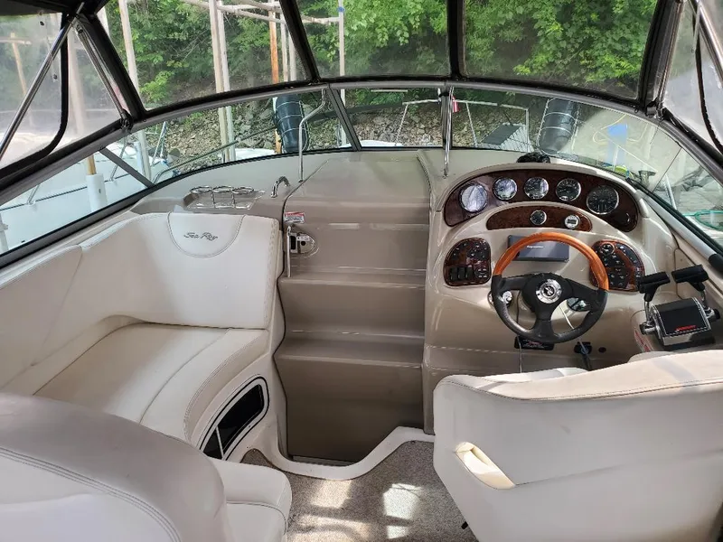 Slide: The Image of Interior of a 2006 Sea Ray 280 Sundancer boat with steering wheel and dashboard. - 3
