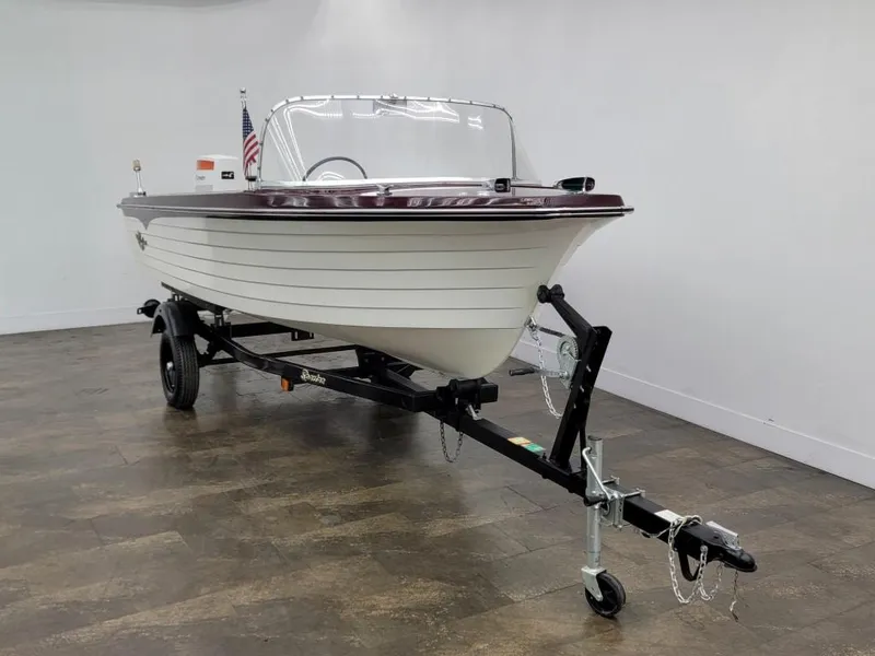 Slide: The Image of 1969 Crestliner Marauder boat on trailer in showroom. - 10