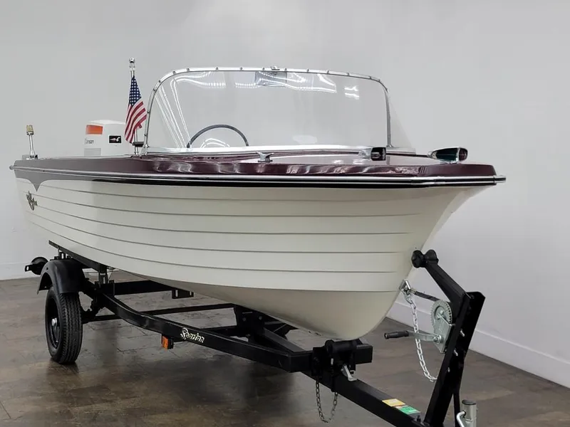 Slide: The Image of 1969 Crestliner Marauder boat on trailer with American flag. - 11
