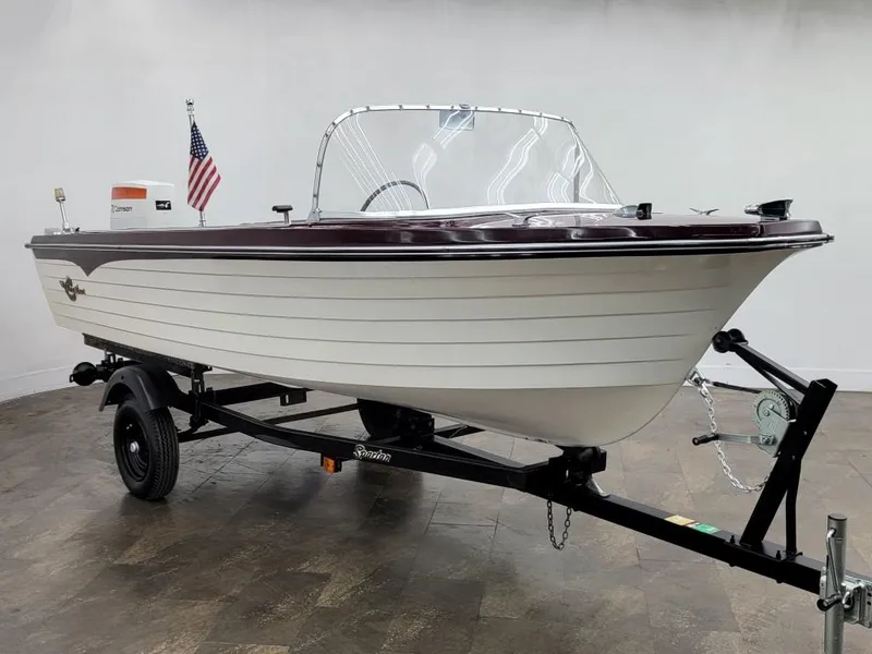 Slide: The Image of 1969 Crestliner Marauder boat on trailer with American flag. - 12