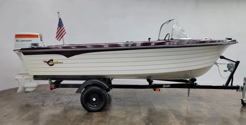 Slide: The Image of 1969 Crestliner Marauder boat on trailer with Johnson 70 outboard motor. - 14
