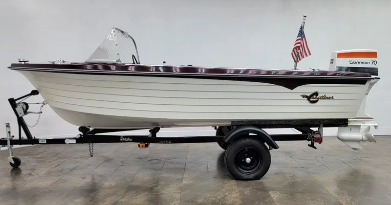 Slide: The Image of 1969 Crestliner Marauder boat on trailer with Johnson 70 outboard motor. - 15