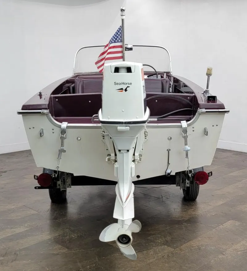 Slide: The Image of 1969 Crestliner Marauder boat with SeaHorse outboard motor and American flag. - 19