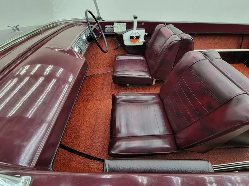 Slide: The Image of 1969 Crestliner Marauder boat interior with maroon seats and red carpet. - 27