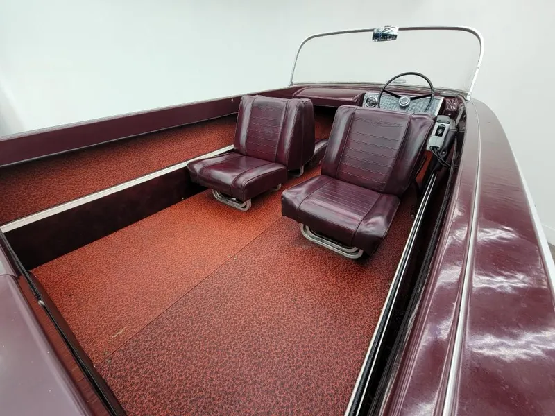 Slide: The Image of 1969 Crestliner Marauder boat interior with red seats and carpet. - 39