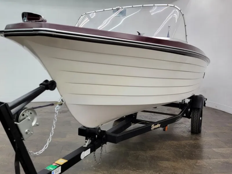 Slide: The Image of 1969 Crestliner Marauder boat on trailer in showroom. - 4