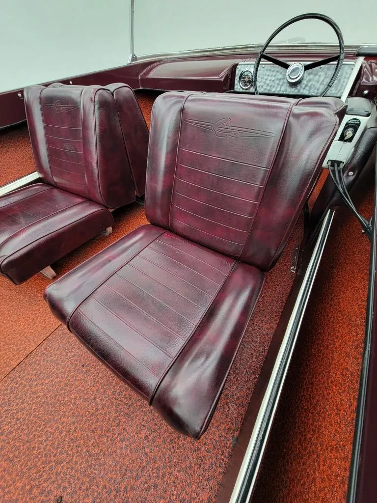 Slide: The Image of 1969 Crestliner Marauder boat interior with maroon seats and vintage dashboard. - 40