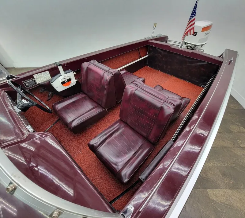Slide: The Image of 1969 Crestliner Marauder boat interior with red seats and carpet. - 41