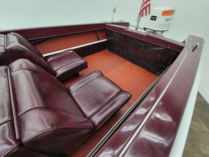 Slide: The Image of 1969 Crestliner Marauder boat interior with maroon seats and red carpet. - 42
