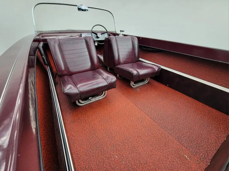 Slide: The Image of 1969 Crestliner Marauder boat interior with red seats and carpet. - 43